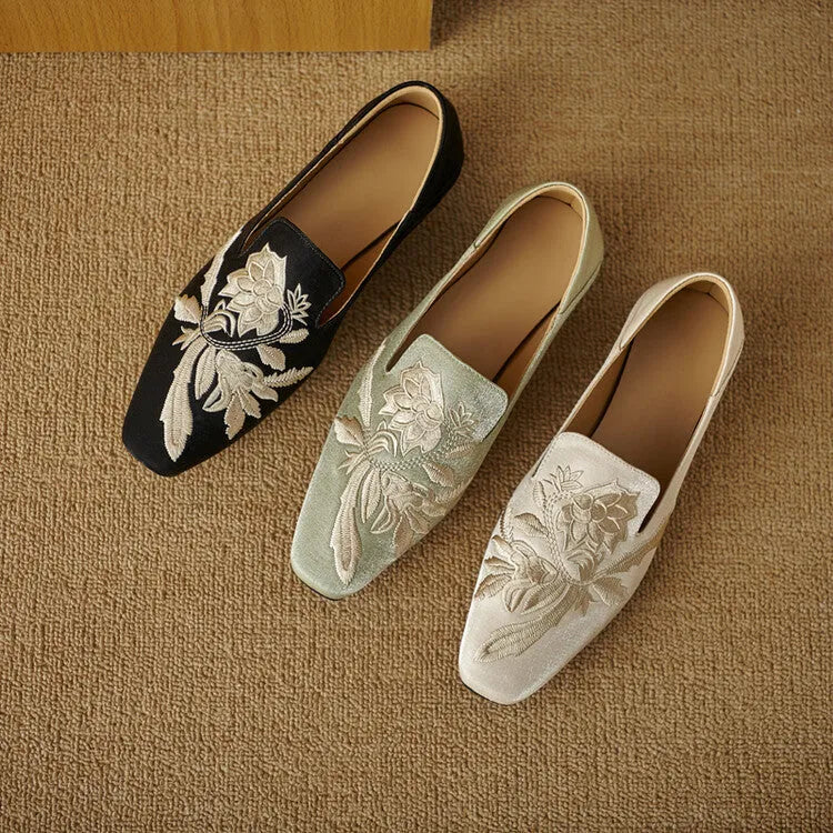 Women's beige retro flat pumps with embroidery detail, round toe, and a low-cut design on a soft bottom.