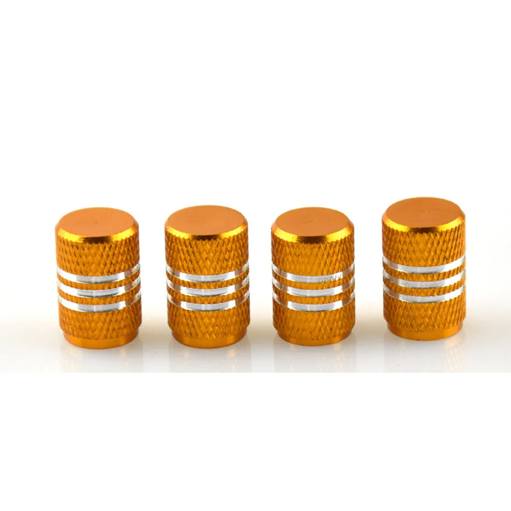 Set of aluminium alloy car tyre valve caps in multiple metallic colours showing stainless steel construction