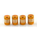 Set of aluminium alloy car tyre valve caps in multiple metallic colours showing stainless steel construction