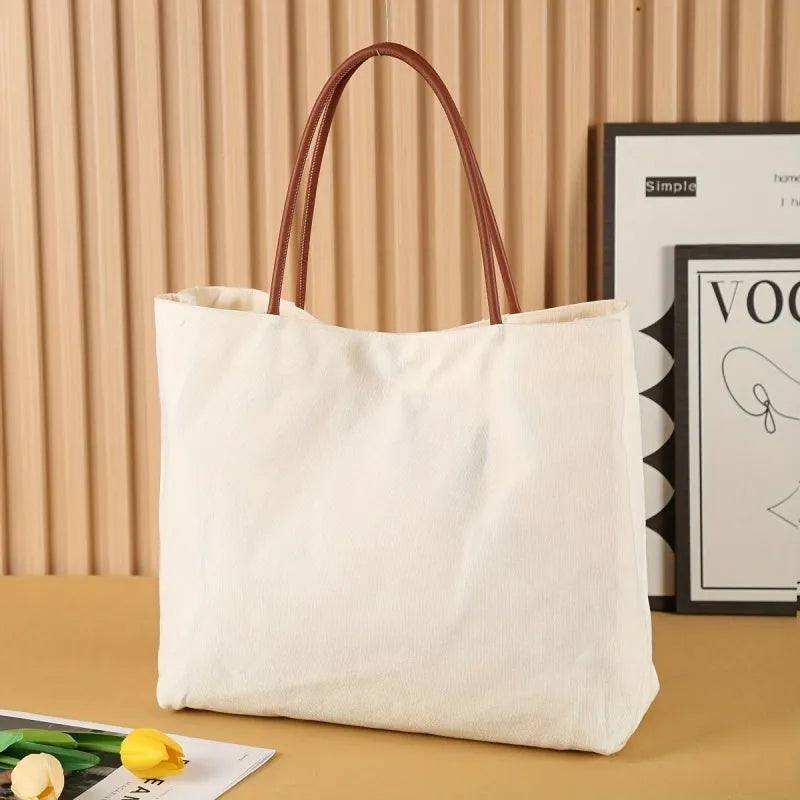 Beige white canvas tote bag with zip closure showing its spacious interior