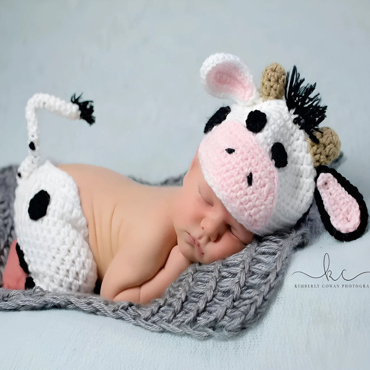 White hand knitted baby cow suit with hat and pants in wool and cotton
