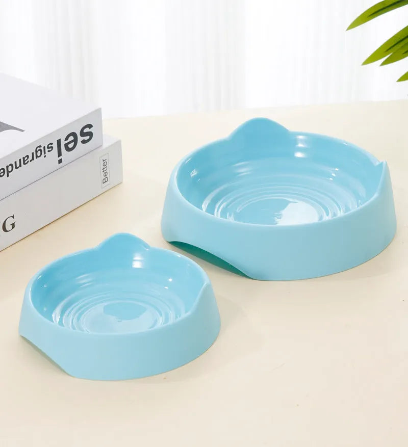 Ceramic dog slow feeder puzzle bowl in blue with non-slip base, shown in S and L sizes.