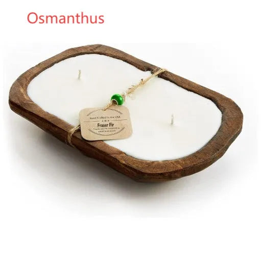 Lavender-scented soy wax candle in a brown wooden basin container with three white wicks.