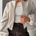 Women's loose fit jacket with lantern sleeves in milky white polyester fabric