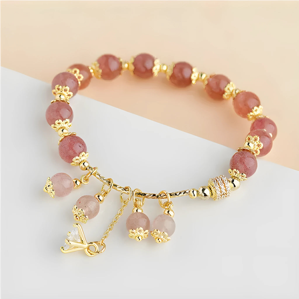 Pink strawberry quartz crystal heart-shaped women's bracelet with pearl accents.