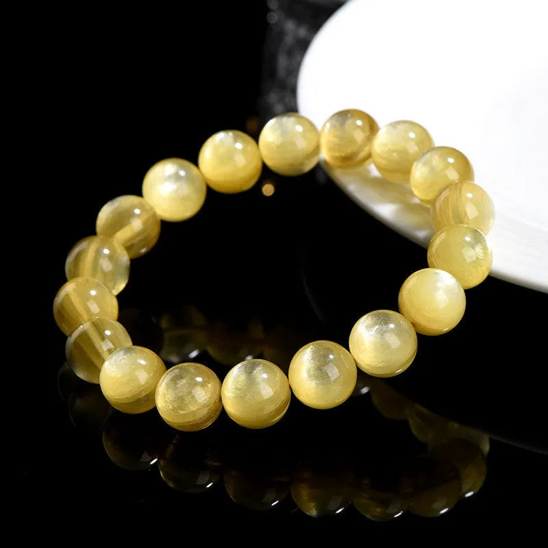 Yellow lepidolite mica bracelet with golden dragon design on round beads