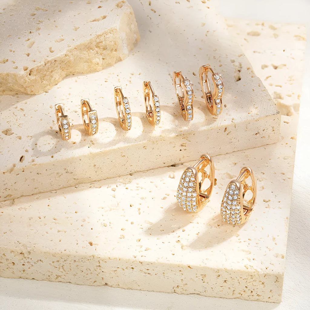 Gold plated heart-shaped ear clip earrings with gang drill decoration on copper base