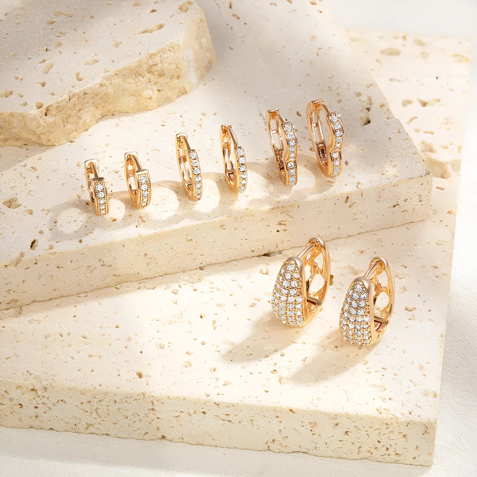 Gold plated heart-shaped ear clip earrings with gang drill decoration on copper base