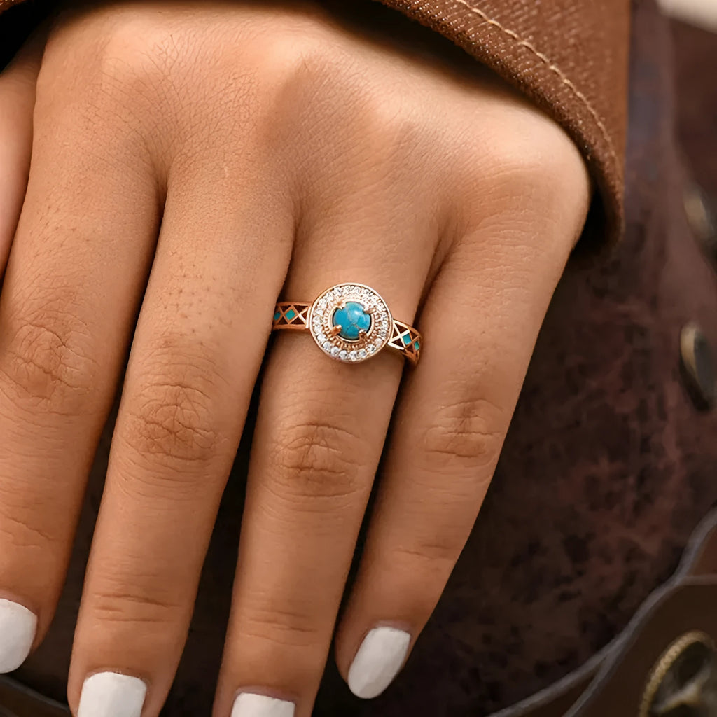 Women's geometric turquoise ring with zircon inlay on rose gold copper band, showing ethnic style design