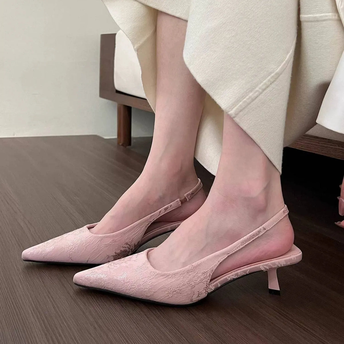 White faux suede mid heel stiletto court shoes with Mary Jane strap, pointed toe, and rubber sole, sizes 35-39