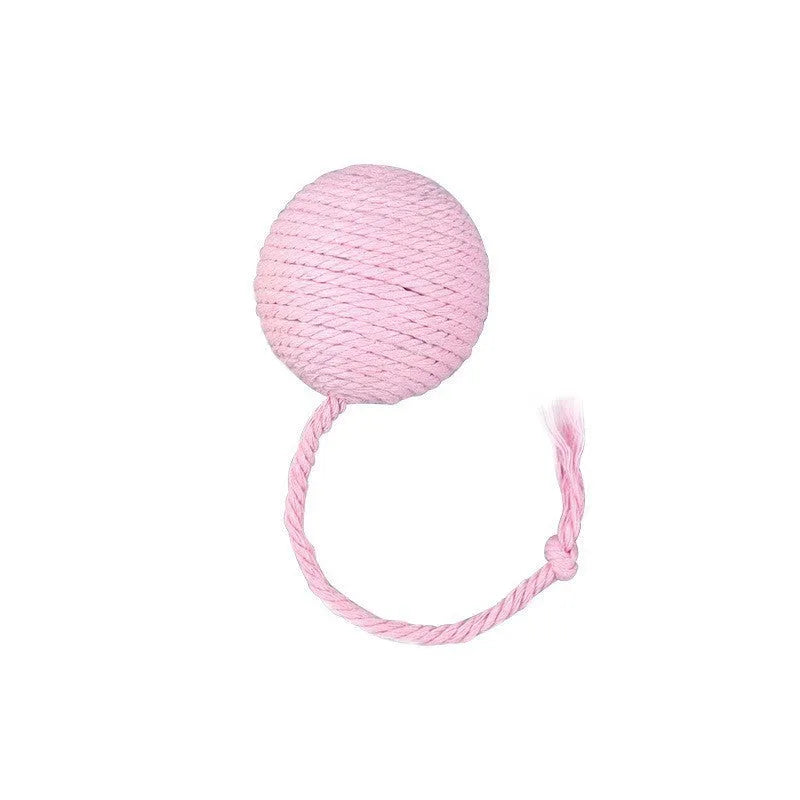 Green cat toy ball with attached rope and internal bell next to a pink one.