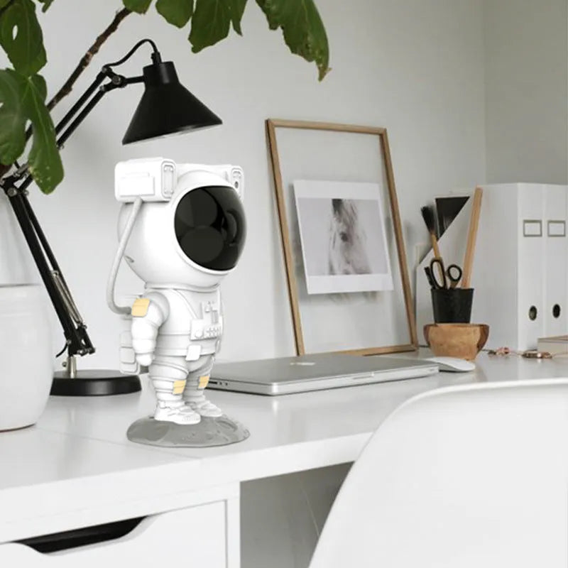 White astronaut-shaped projection night light with USB power and remote control, 120x113x228mm