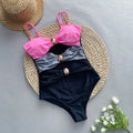 Women's brown one-piece swimsuit with matching beige skirt for swimming and water activities