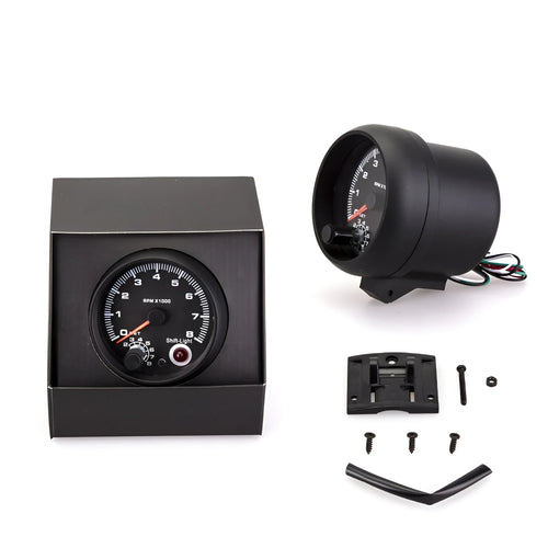 Black automotive tachometer with blue light pointer display showing engine rpm