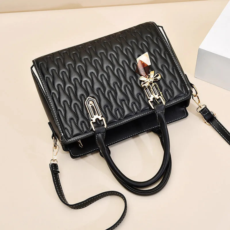 Women's polyester shoulder messenger bag with a front PU pocket in green, showing its structured shape and strap.