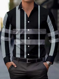 Man wearing a blue striped long sleeve button-up shirt with a lapel collar.