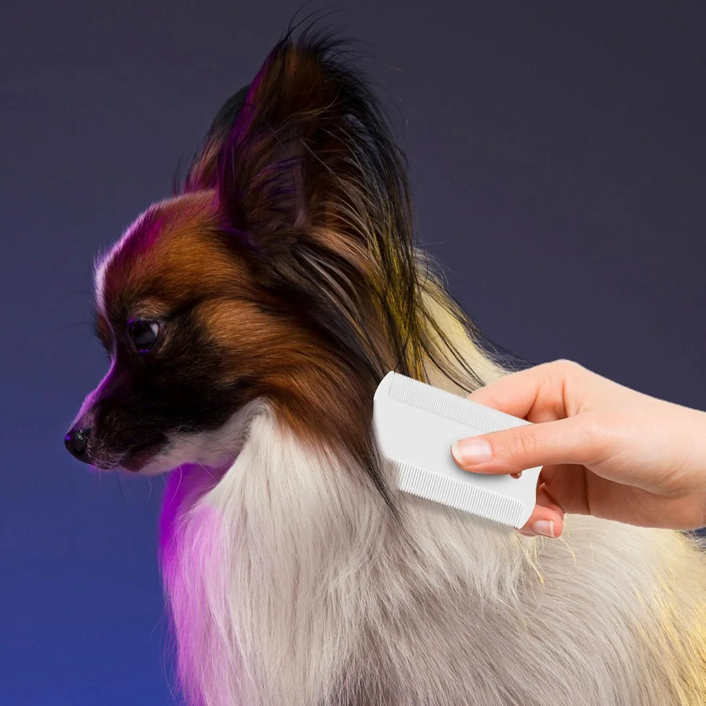 Double-sided dense tooth plastic flea comb for pets, shown with dimensions of 0.85 by 5 centimetres.